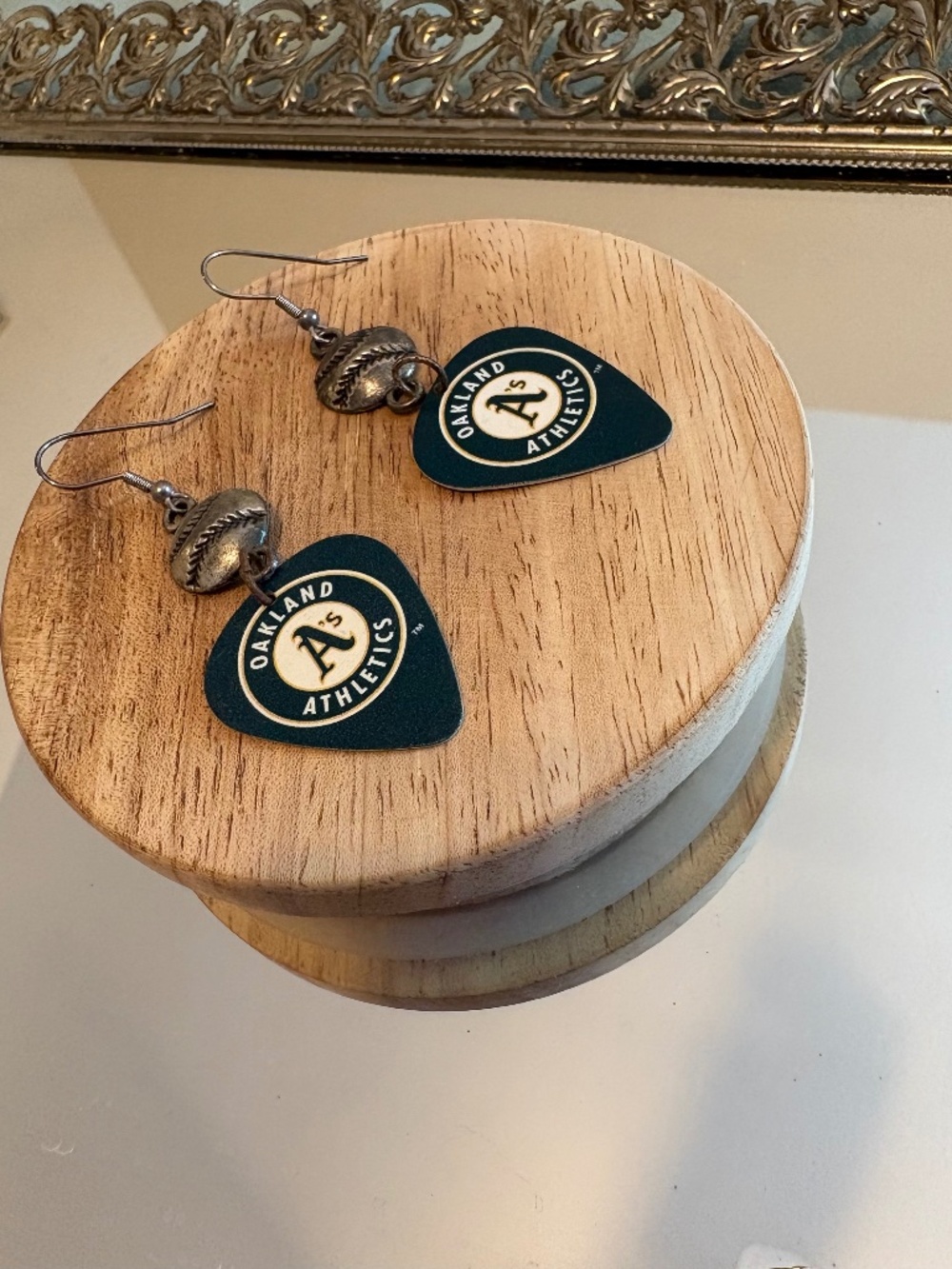 Oakland A’s guitar pick earrings with baseball emblem